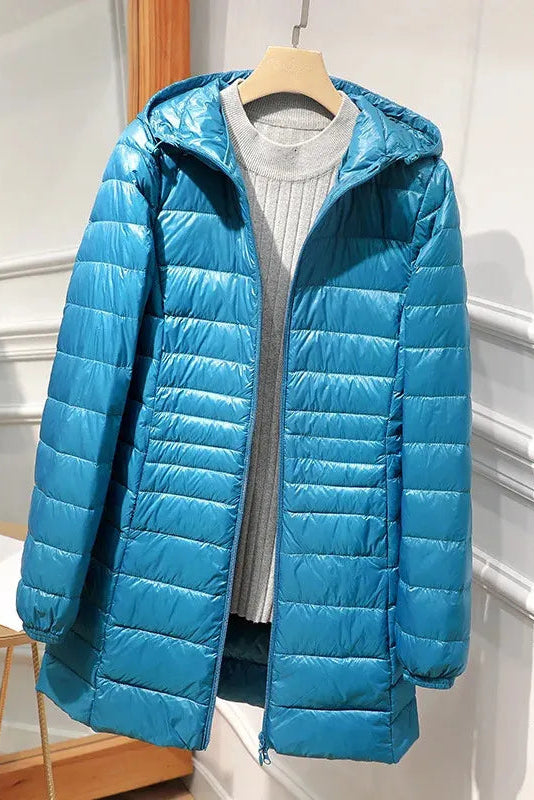 Manteau long matelassé à capuche et fermeture éclair