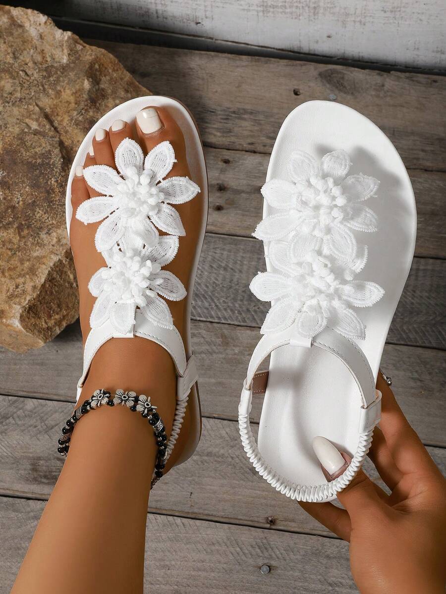 Zeulina | Tongs confortables avec détail floral