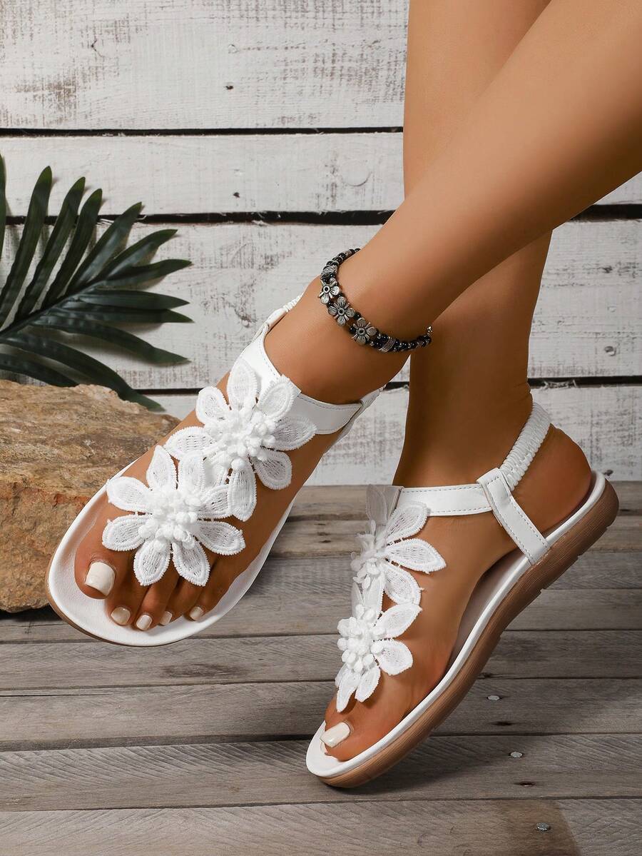 Zeulina | Tongs confortables avec détail floral