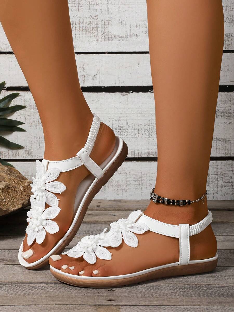 Zeulina | Tongs confortables avec détail floral