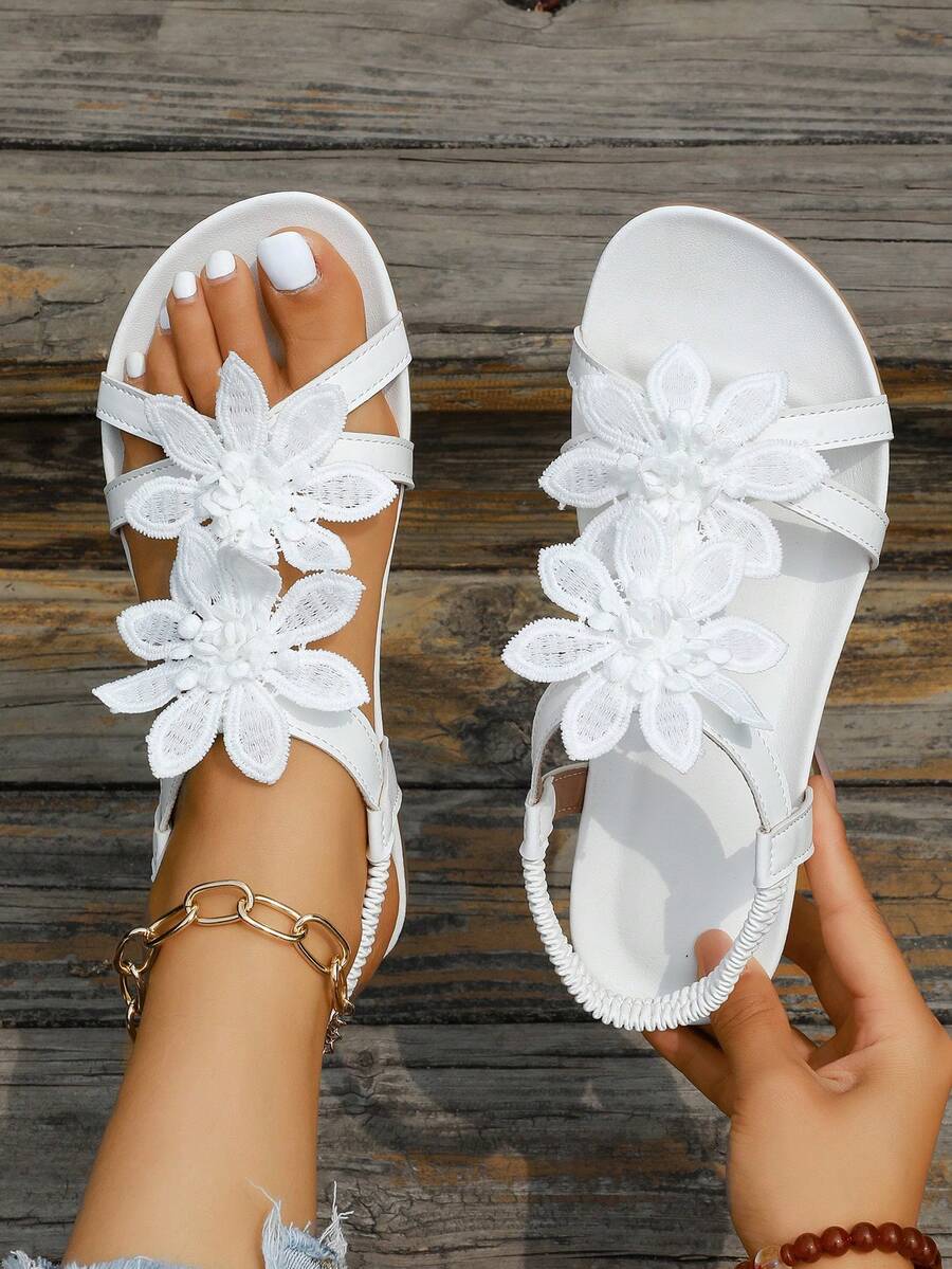 Zeulina | Tongs confortables avec détail floral