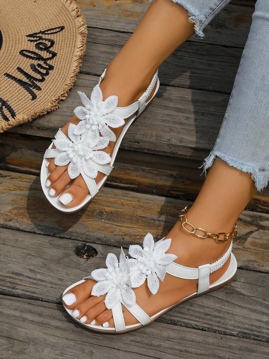 Zeulina | Tongs confortables avec détail floral