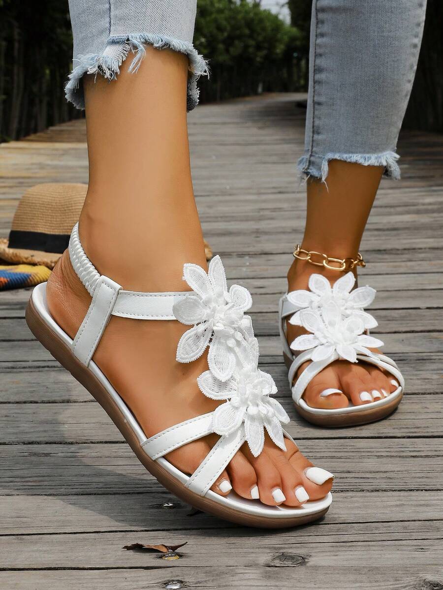 Zeulina | Tongs confortables avec détail floral