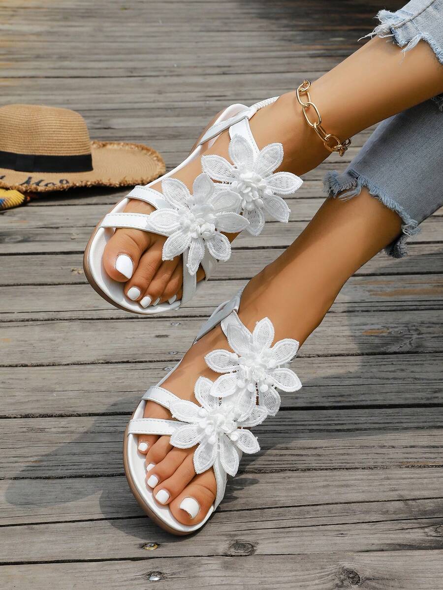 Zeulina | Tongs confortables avec détail floral