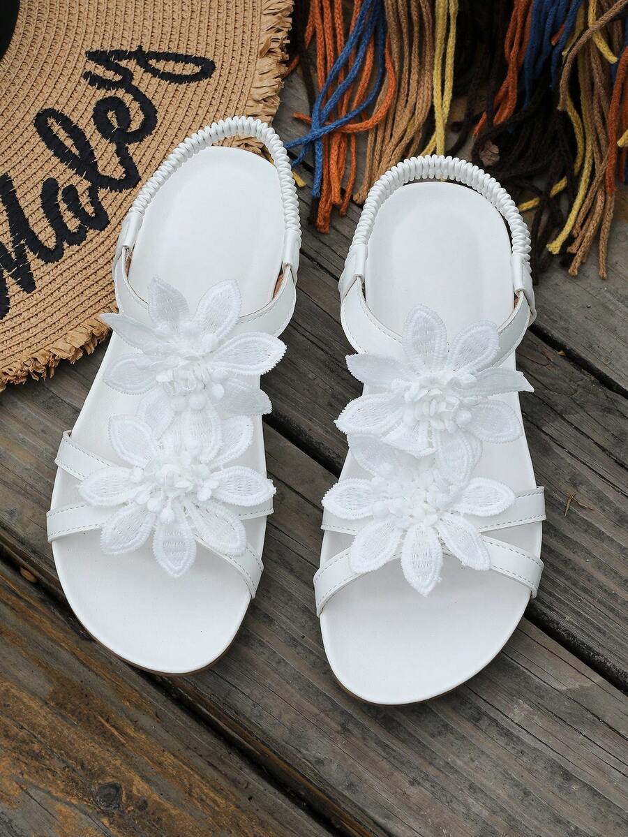 Zeulina | Tongs confortables avec détail floral
