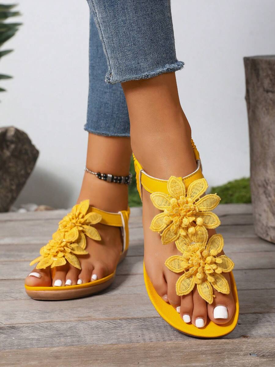 Zeulina | Tongs confortables avec détail floral