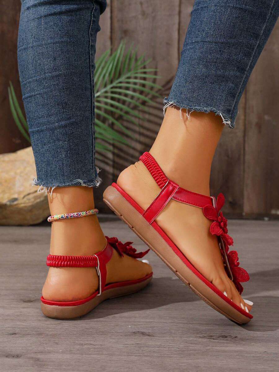 Zeulina | Tongs confortables avec détail floral