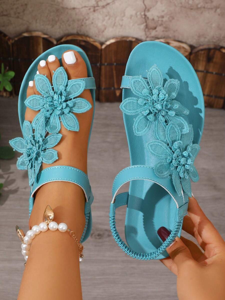Zeulina | Tongs confortables avec détail floral