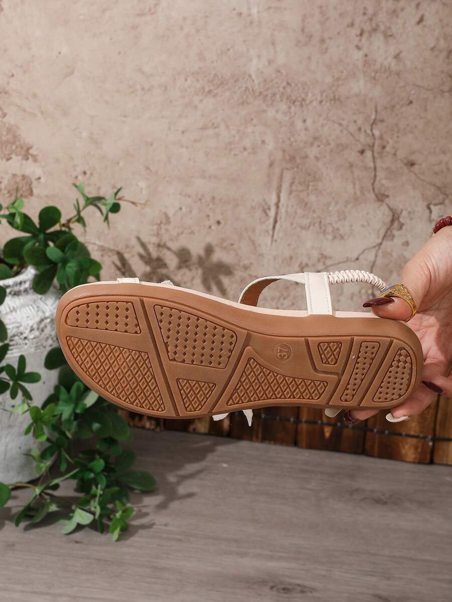 Zeulina | Tongs confortables avec détail floral