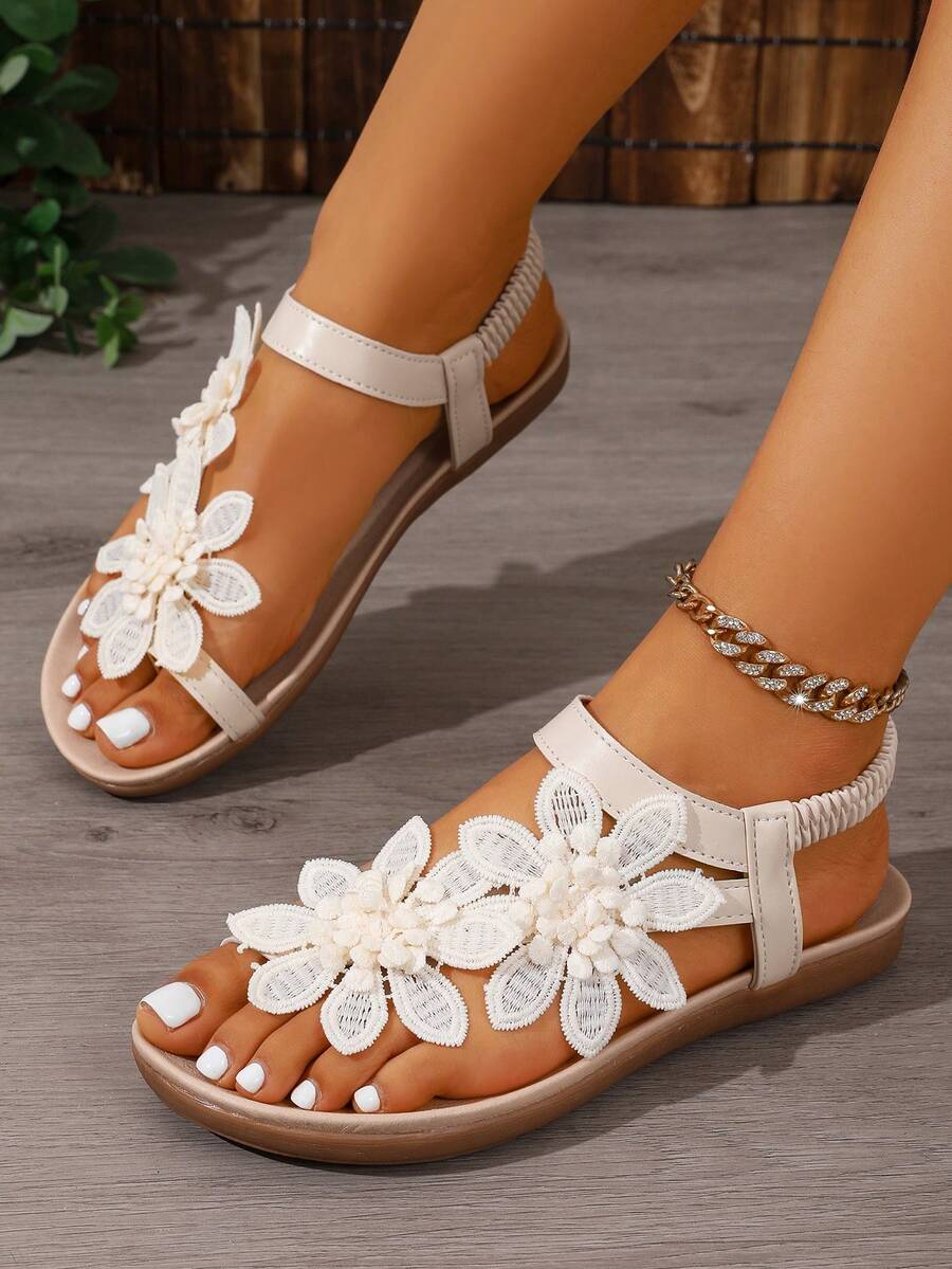 Zeulina | Tongs confortables avec détail floral