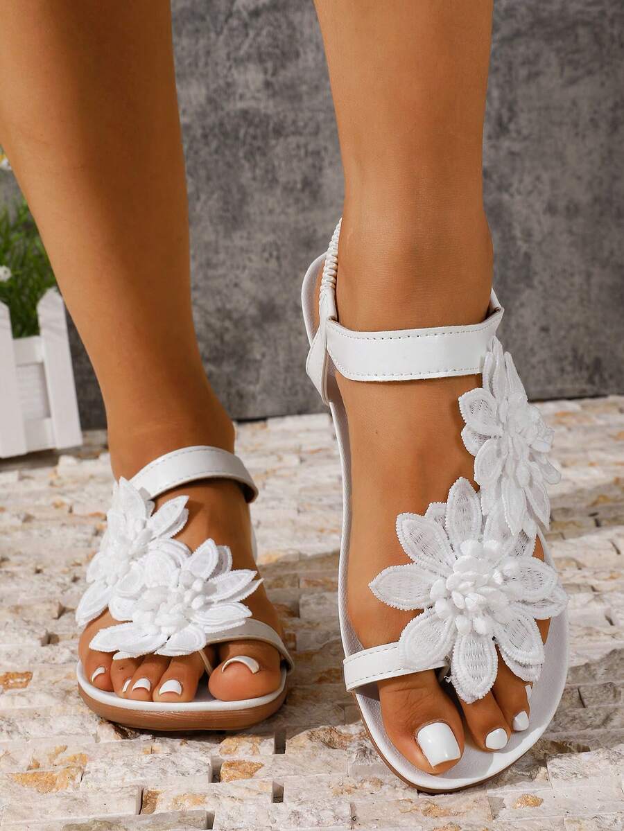 Zeulina | Tongs confortables avec détail floral