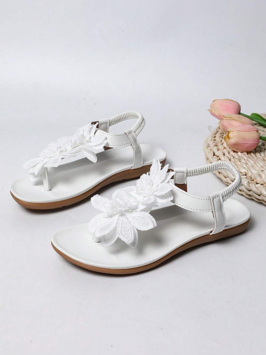 Zeulina | Tongs confortables avec détail floral