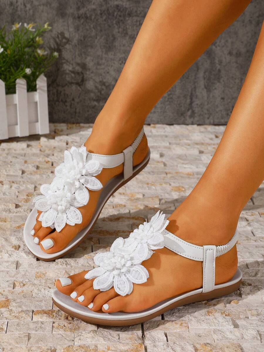 Zeulina | Tongs confortables avec détail floral