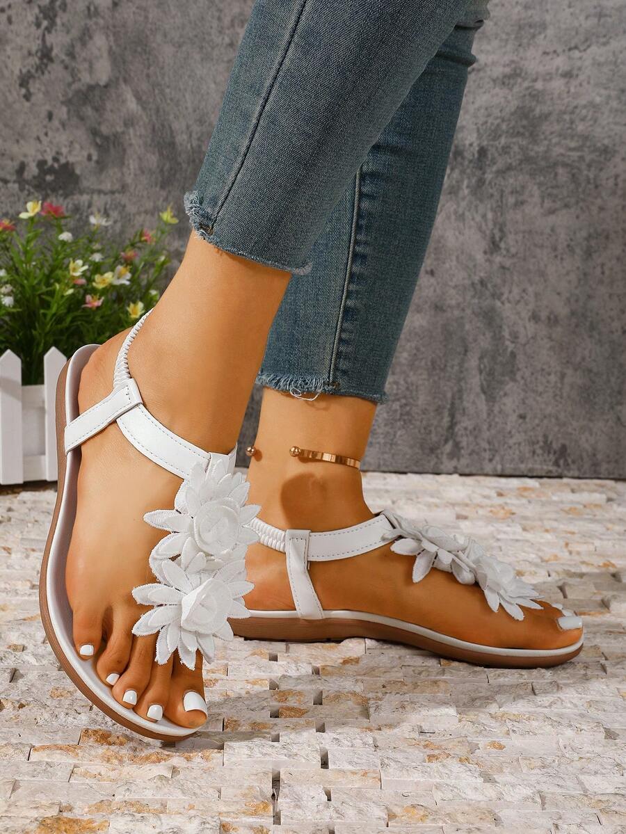 Zeulina | Tongs confortables avec détail floral