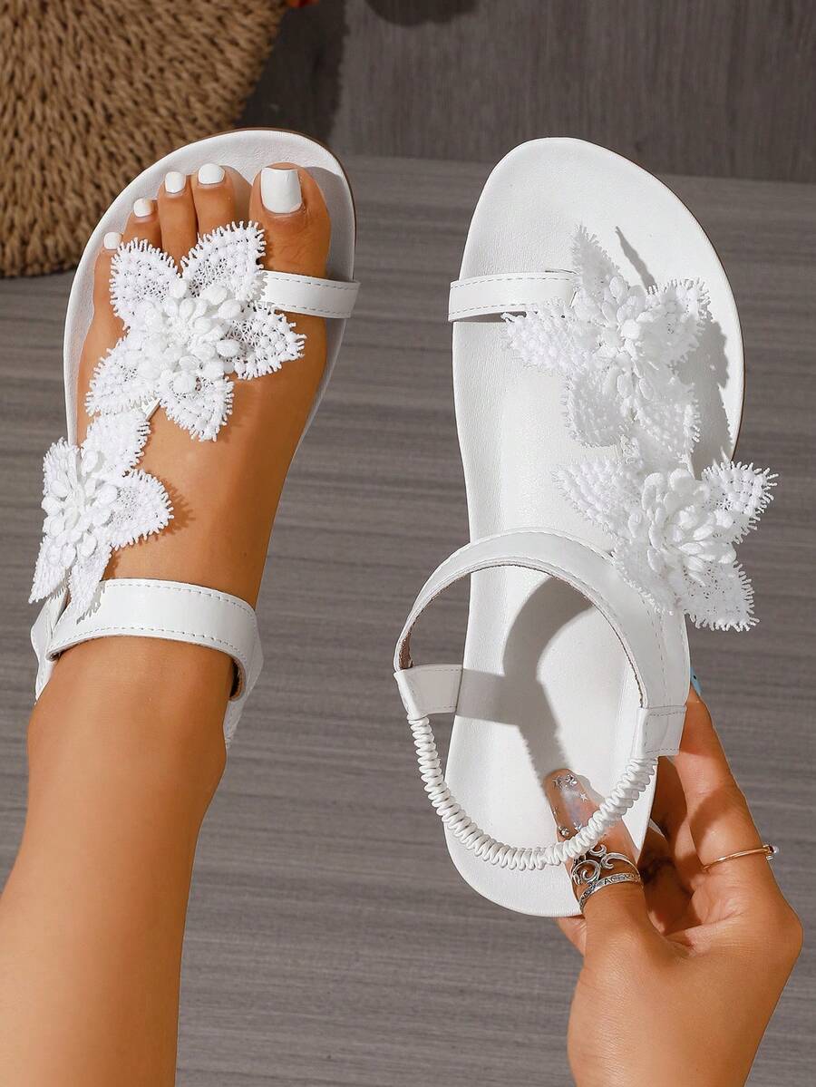 Zeulina | Tongs confortables avec détail floral