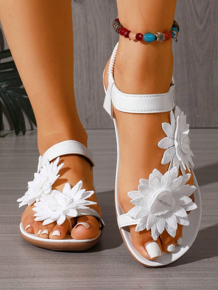 Zeulina | Tongs confortables avec détail floral