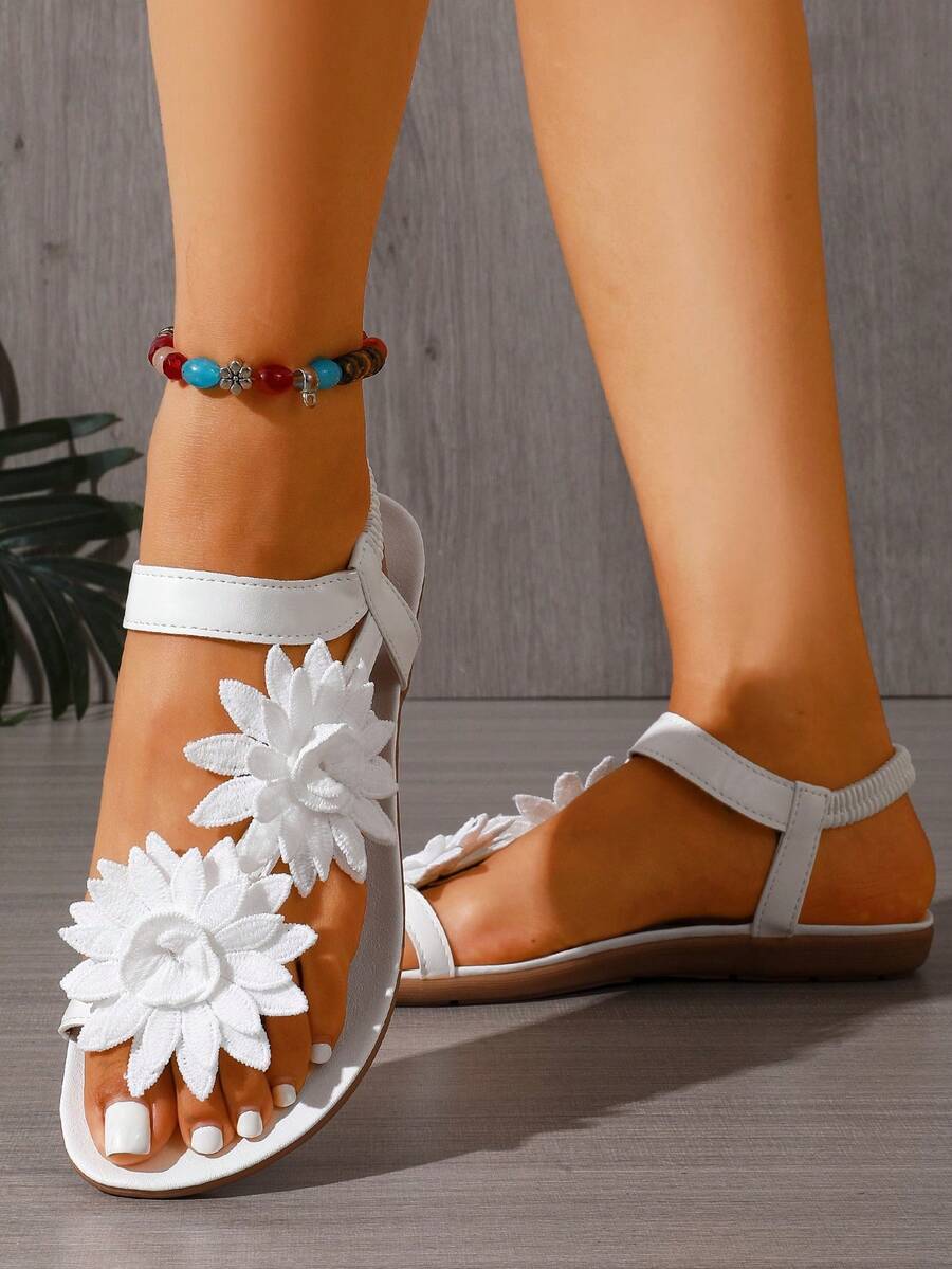 Zeulina | Tongs confortables avec détail floral