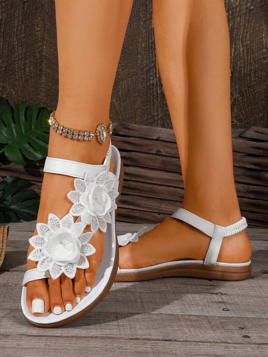 Zeulina | Tongs confortables avec détail floral