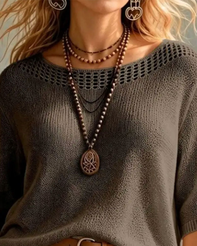 Pull à col rond avec découpe