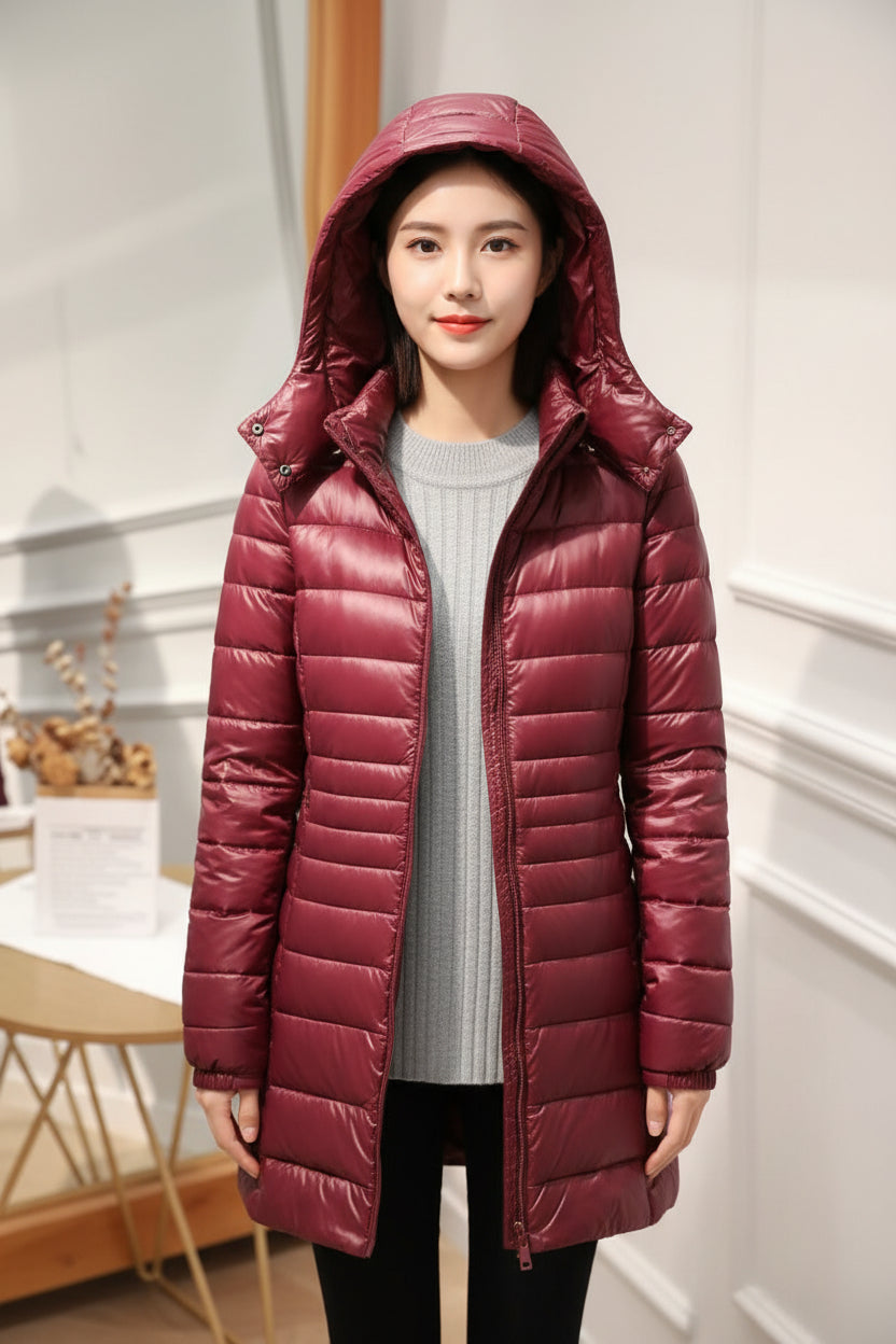 Manteau long matelassé à capuche et fermeture éclair