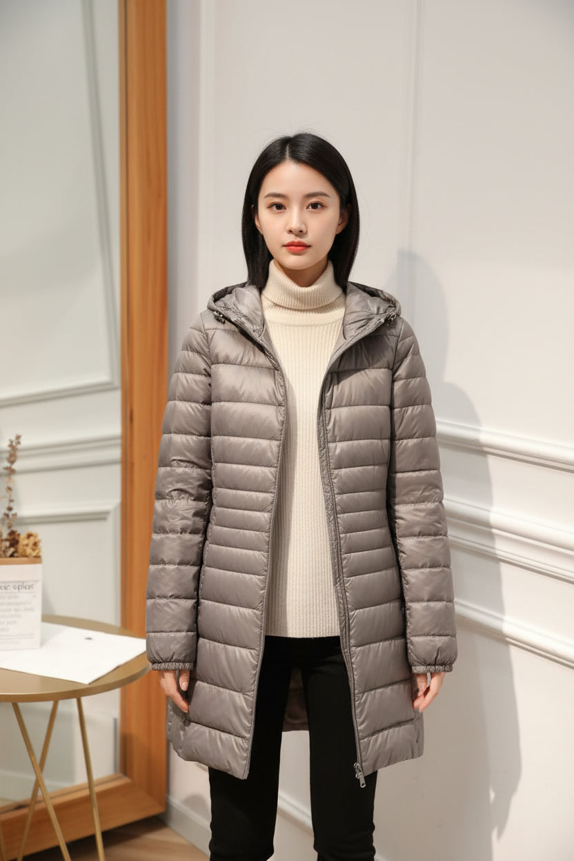 Manteau long matelassé à capuche et fermeture éclair