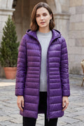 Manteau long matelassé à capuche et fermeture éclair