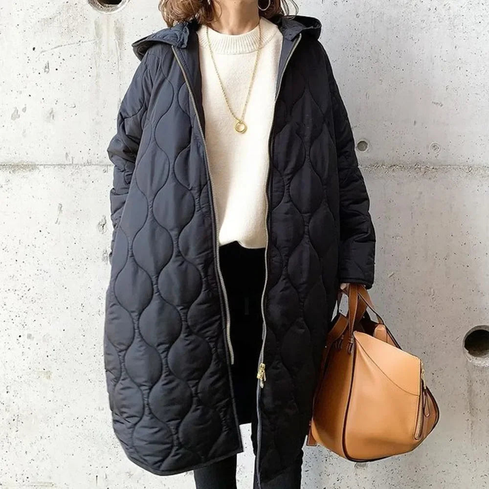 Veste matelassée pour femme avec coupe longue, capuche et fermeture éclair