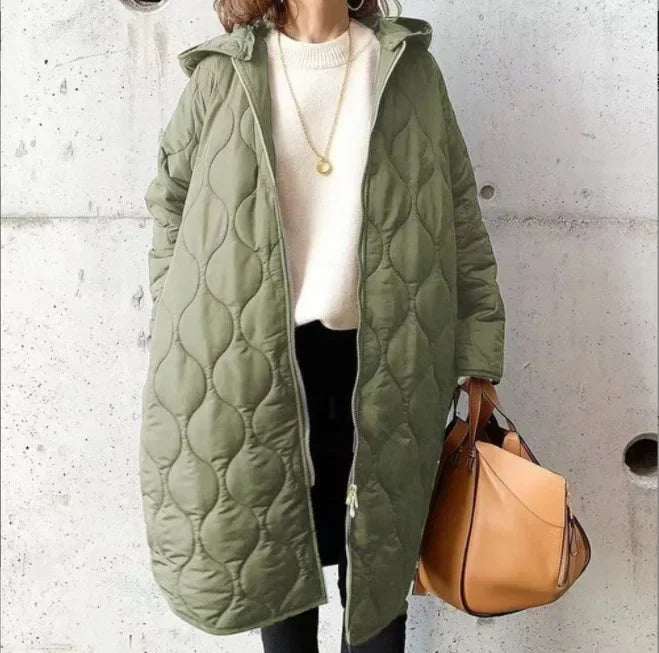Veste matelassée pour femme avec coupe longue, capuche et fermeture éclair