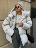 Veste d'hiver stylée pour femme en oversize avec capuche