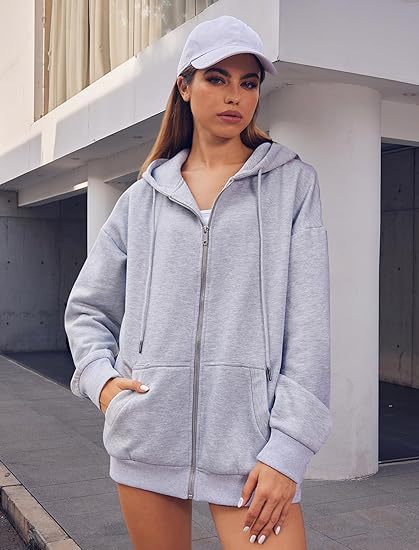 Veste à capuche zippée oversize pour femmes avec fermeture éclair contrastante, capuche double épaisseur et poche kangourou Echo Archiv