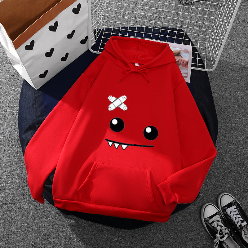 Sweat à capuche pour femmes avec un visage de monstre ludique, application de bandage et poche kangourou Echo Archiv