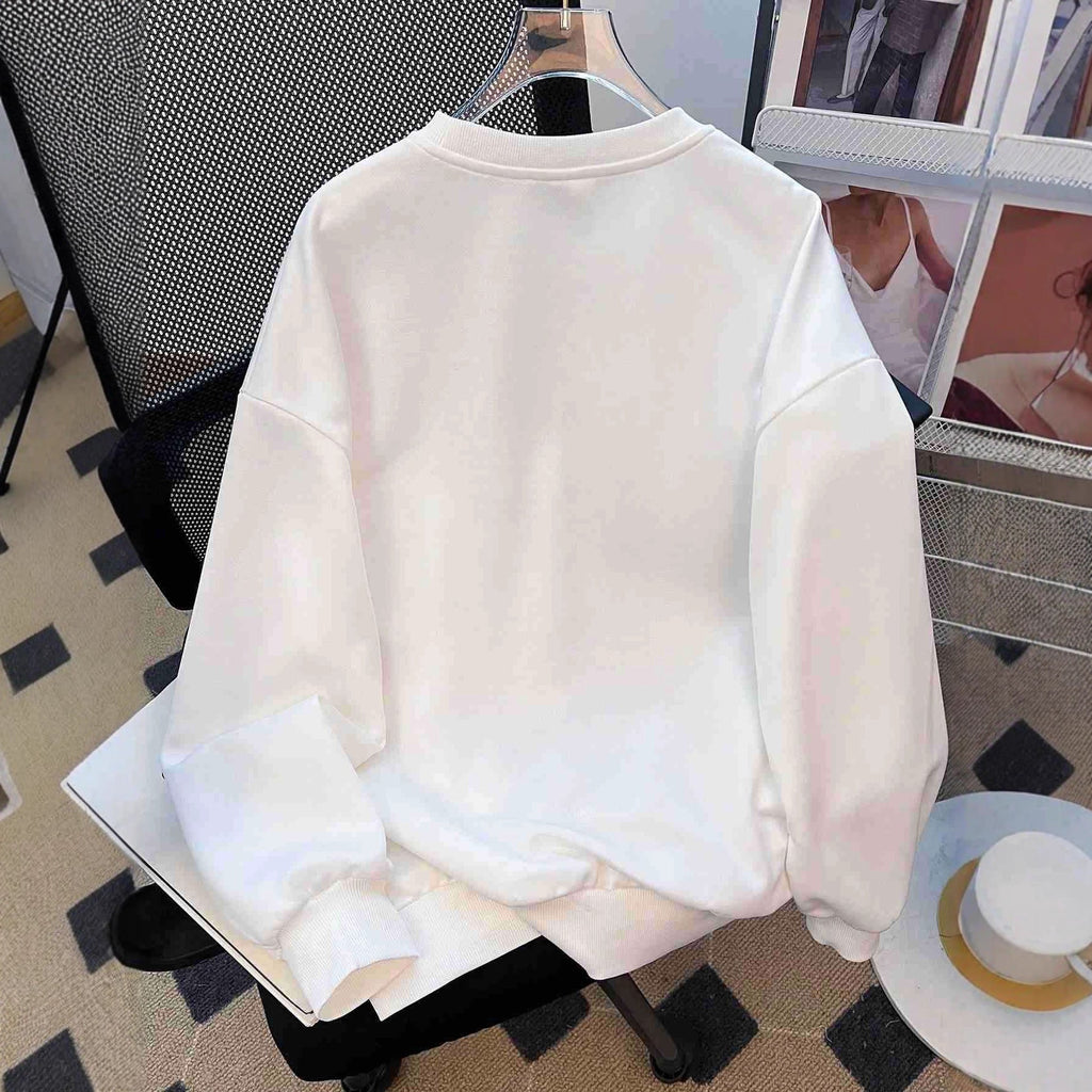 Sweat-shirt oversize décontracté pour femmes avec des appliqués étoile brodés en denim et ourlet côtelé Echo Archiv
