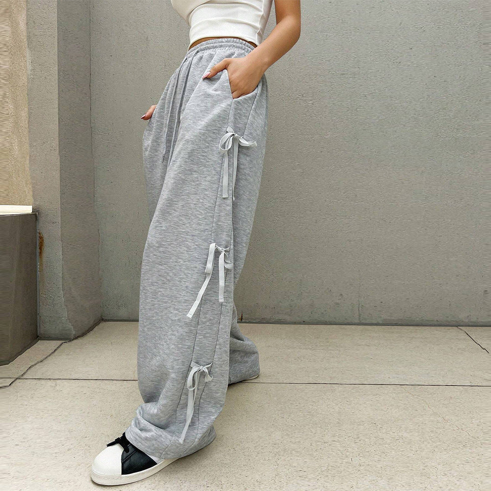 Pantalon lounge large pour femmes avec taille élastique, cordon de serrage et nœuds décoratifs sur les côtés