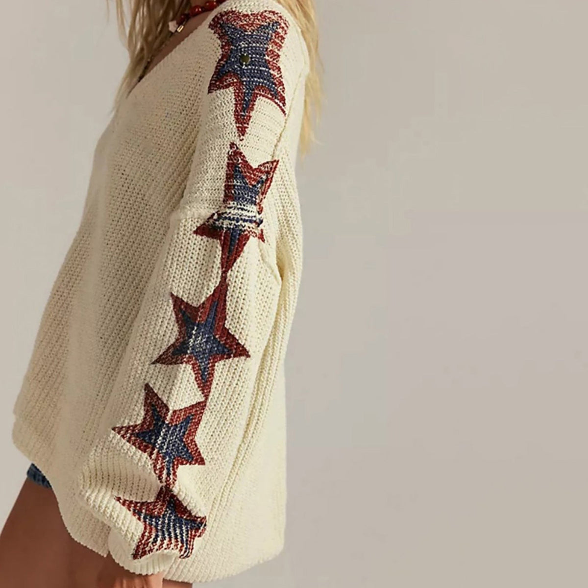 Pull en tricot oversize pour femmes avec décolleté en V et motifs d'étoiles Echoarchiv