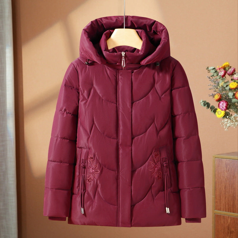 Veste thermique outdoor matelassée pour femmes avec capuche ergonomique et broderie florale sur les poches Echo Archiv