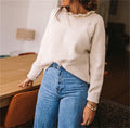 Pull en maille côtelée pour femmes avec col à volants et patte de boutonnage latérale