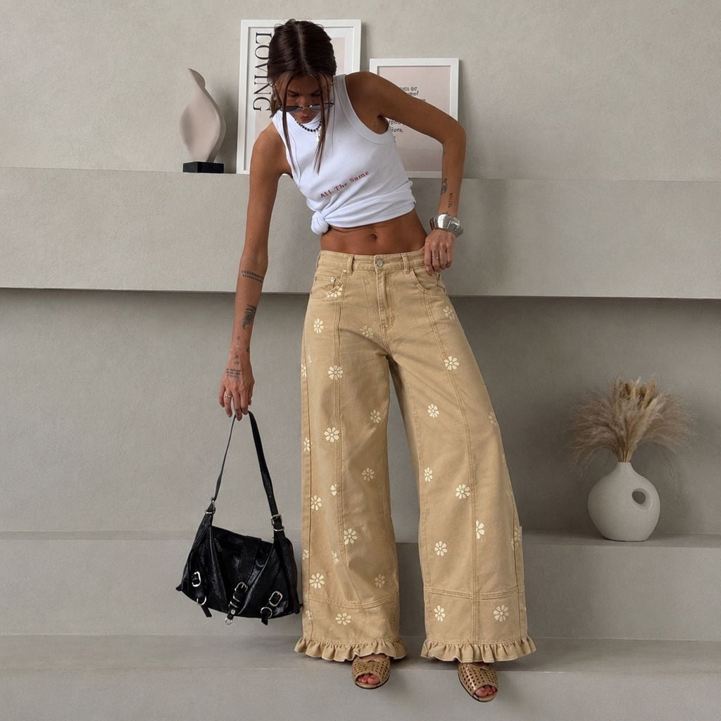 Pantalon en denim large pour femmes avec imprimé marguerite, taille haute et finition à volants Echo Archiv