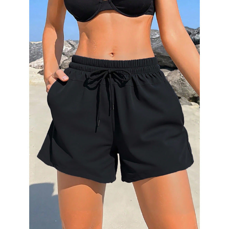 Shorts de sport pour femmes avec taille élastique et poches latérales pratiques R&B