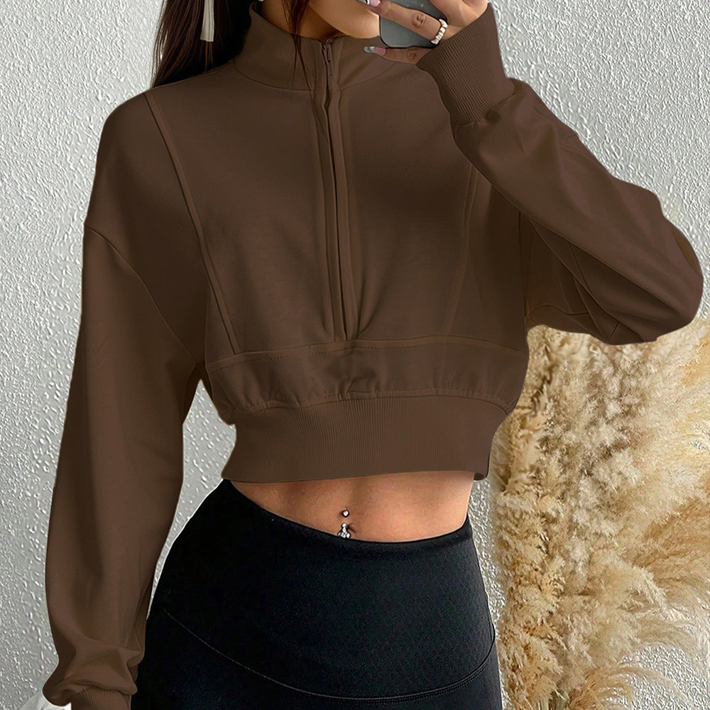 Sweat-shirt court à col montant pour femmes avec demi-zip, taille cintrée et manches avec trou pour le pouce
