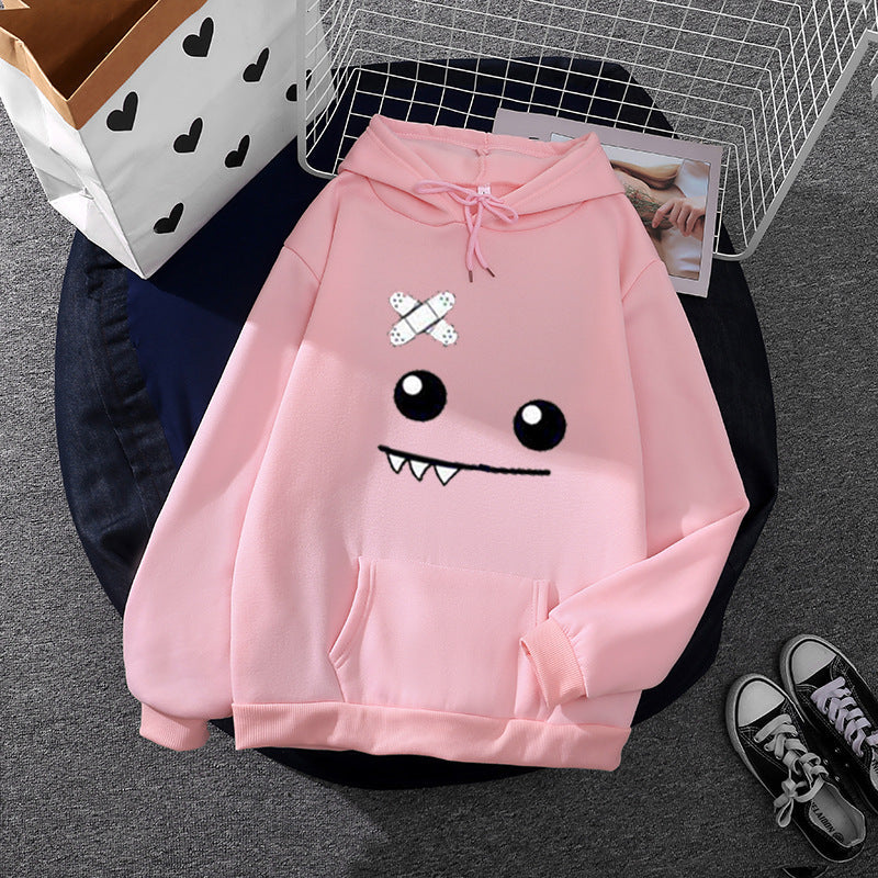 Sweat à capuche pour femmes avec un visage de monstre ludique, application de bandage et poche kangourou Echo Archiv