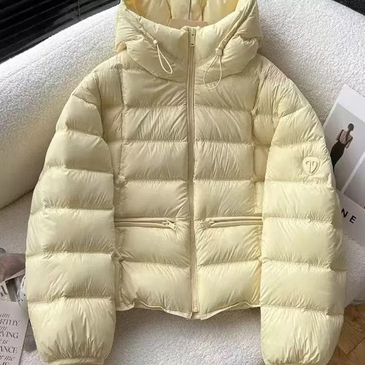 Veste thermo matelassée courte pour femmes avec capuche, poches zippées et bords élastiques Echo Archiv