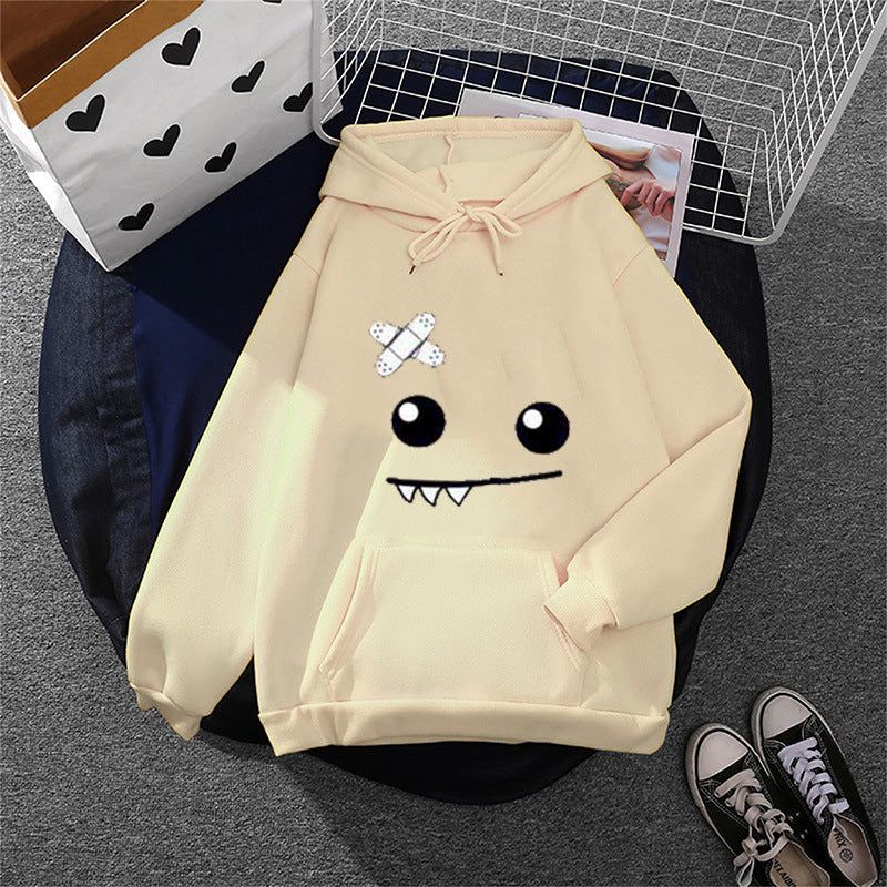 Sweat à capuche pour femmes avec un visage de monstre ludique, application de bandage et poche kangourou Echo Archiv
