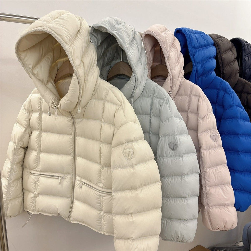 Veste thermo matelassée courte pour femmes avec capuche, poches zippées et bords élastiques Echo Archiv