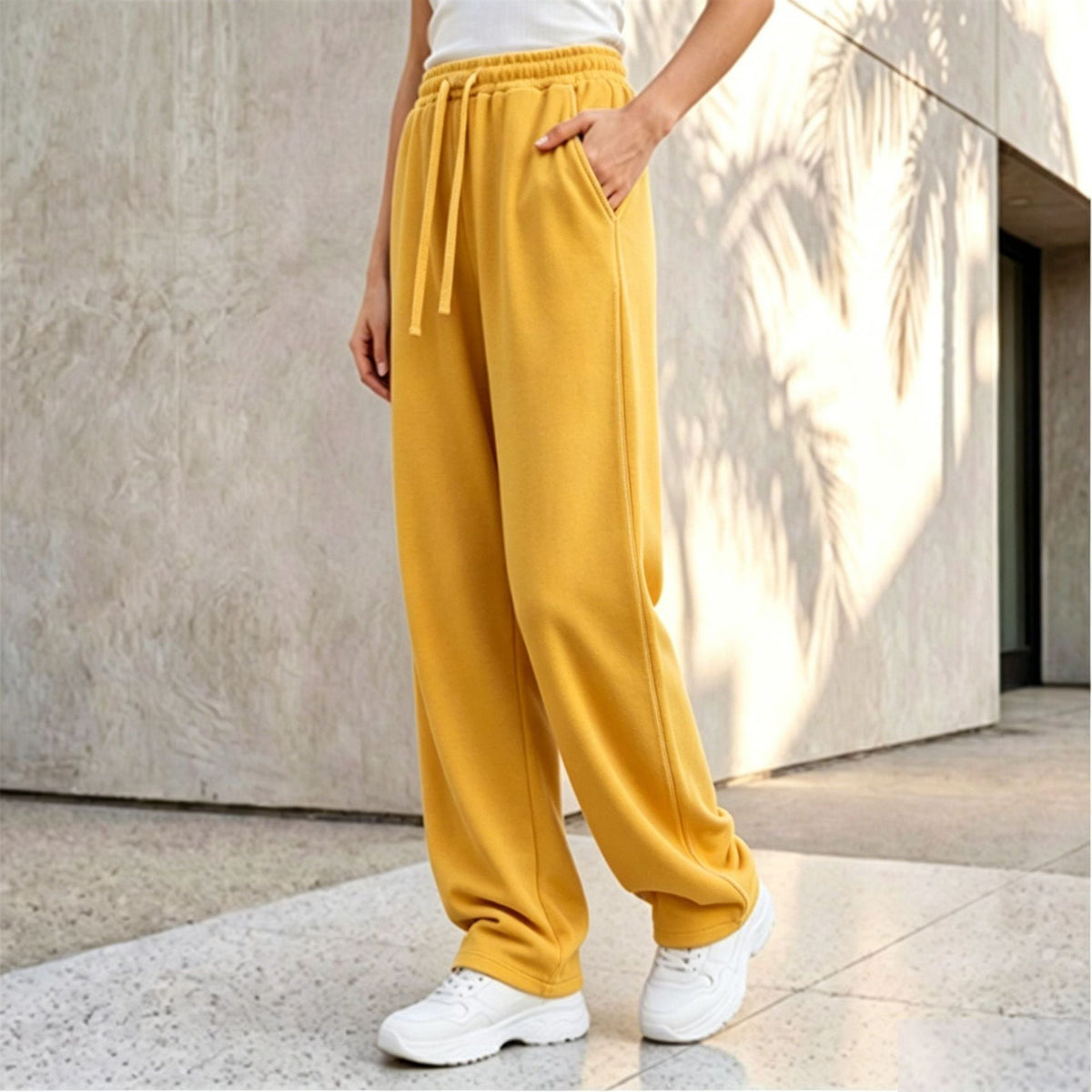 Pantalon palazzo lounge pour femmes avec taille confortable, cordon de serrage, poches latérales et couture décorative Echo Archiv