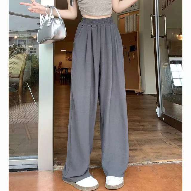 Pantalon palazzo large en look lin pour femmes avec taille haute, ceinture élastique et poches