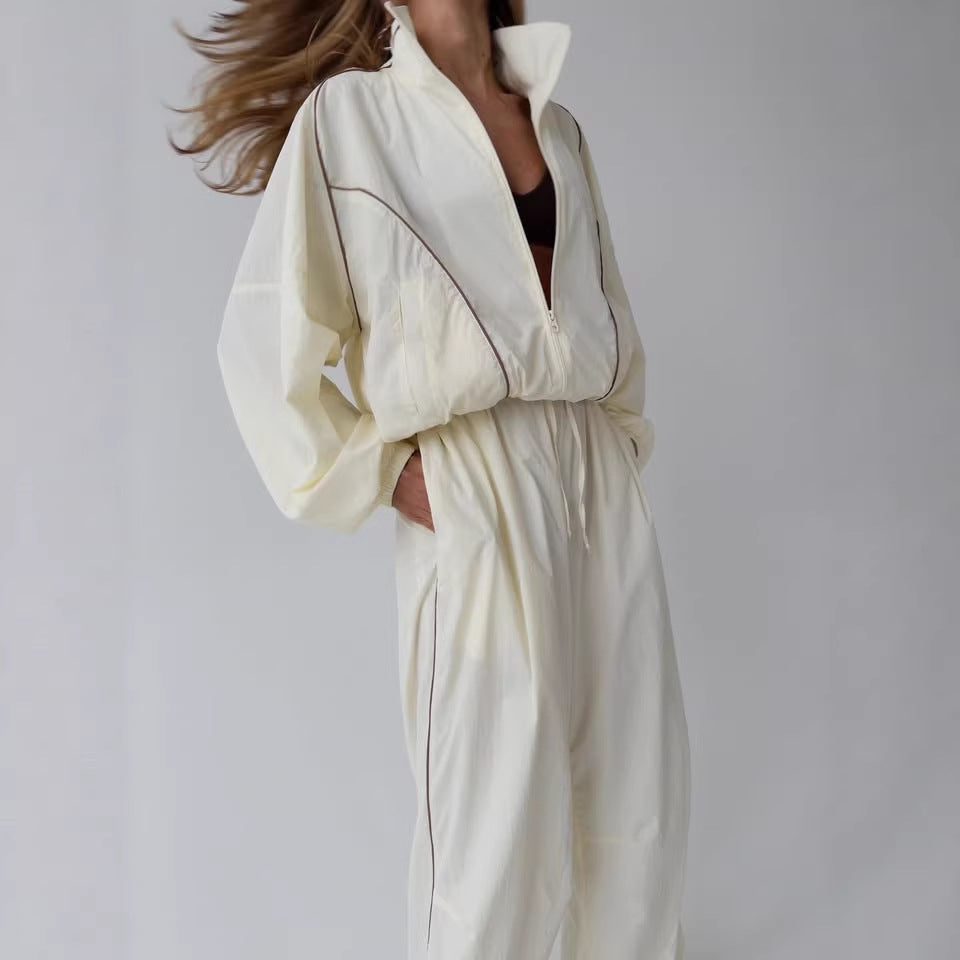 Veste légère à capuche pour femmes, ensemble à deux pièces avec col montant, fermeture éclair intégrale, couture en contraste et pantalon palazzo ample Echo Archiv