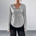 T-shirt à manches longues pour femmes avec décolleté en V, col ouvert, jersey doux et ourlet arrondi