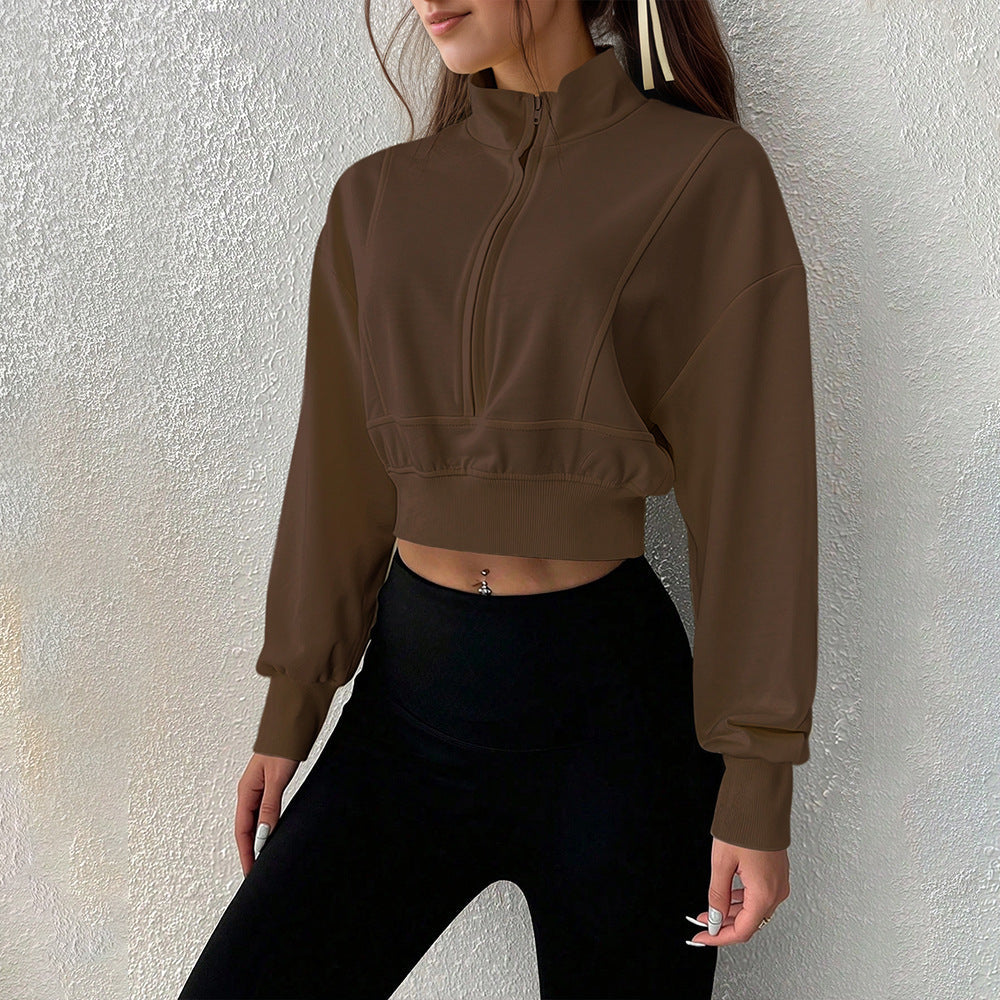 Sweat-shirt court à col montant pour femmes avec demi-zip, taille cintrée et manches avec trou pour le pouce
