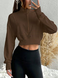 Sweat-shirt court à col montant pour femmes avec demi-fermeture éclair, taille cintrée et manches avec trou pour le pouce