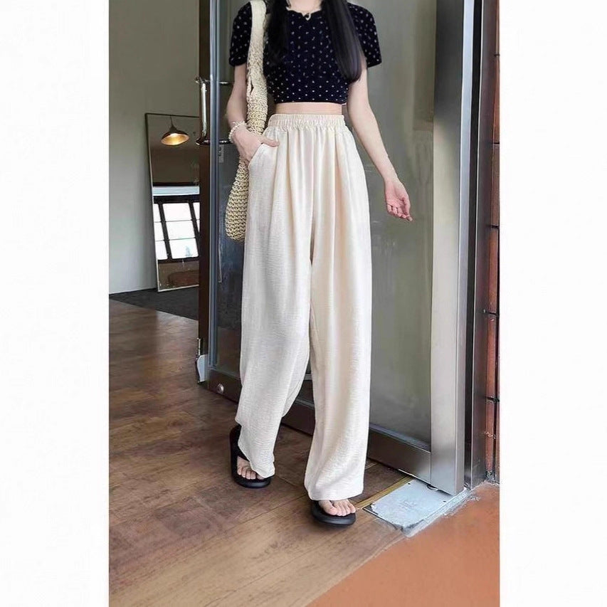 Pantalon palazzo large en look lin pour femmes avec taille haute, ceinture élastique et poches